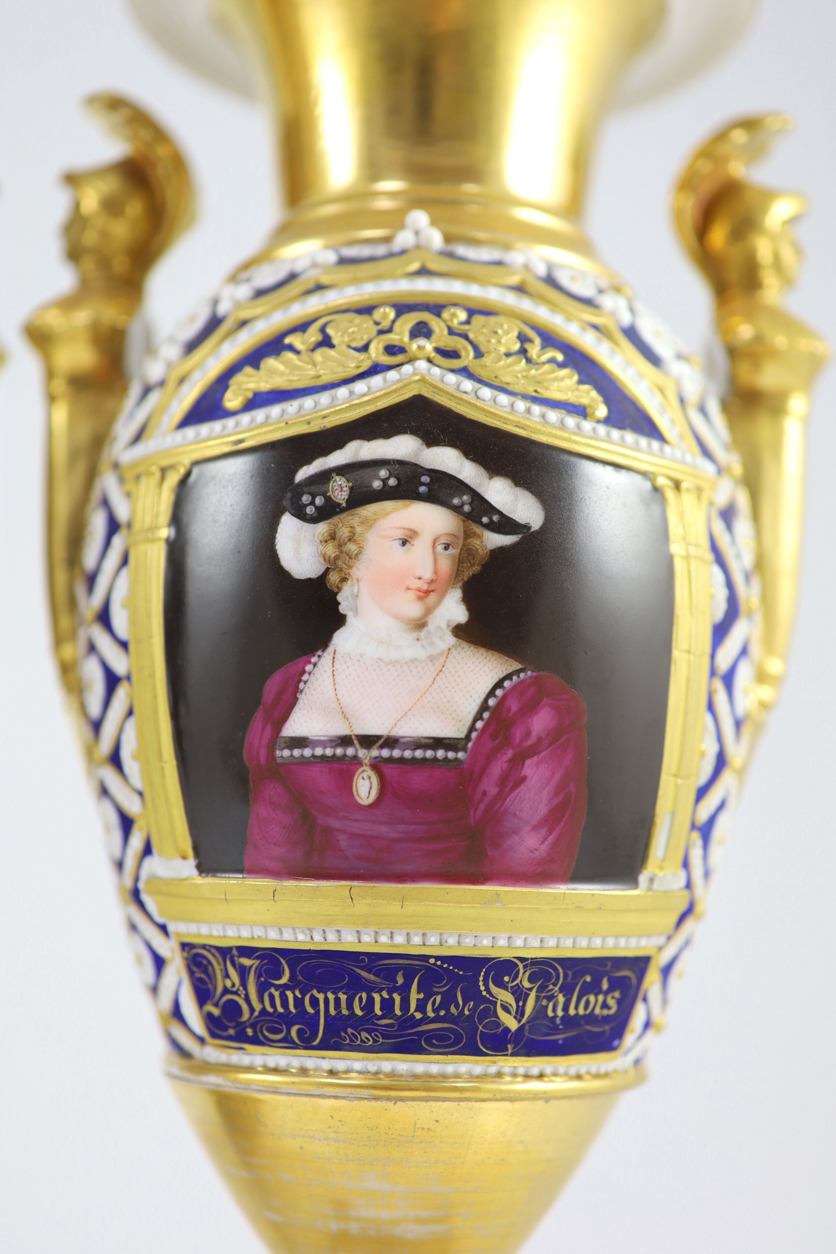 A pair of Paris porcelain vases, early 19th century, 33.5 cm high, one base restored